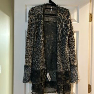 Beautiful free people cardigan with ruffles at the bottom